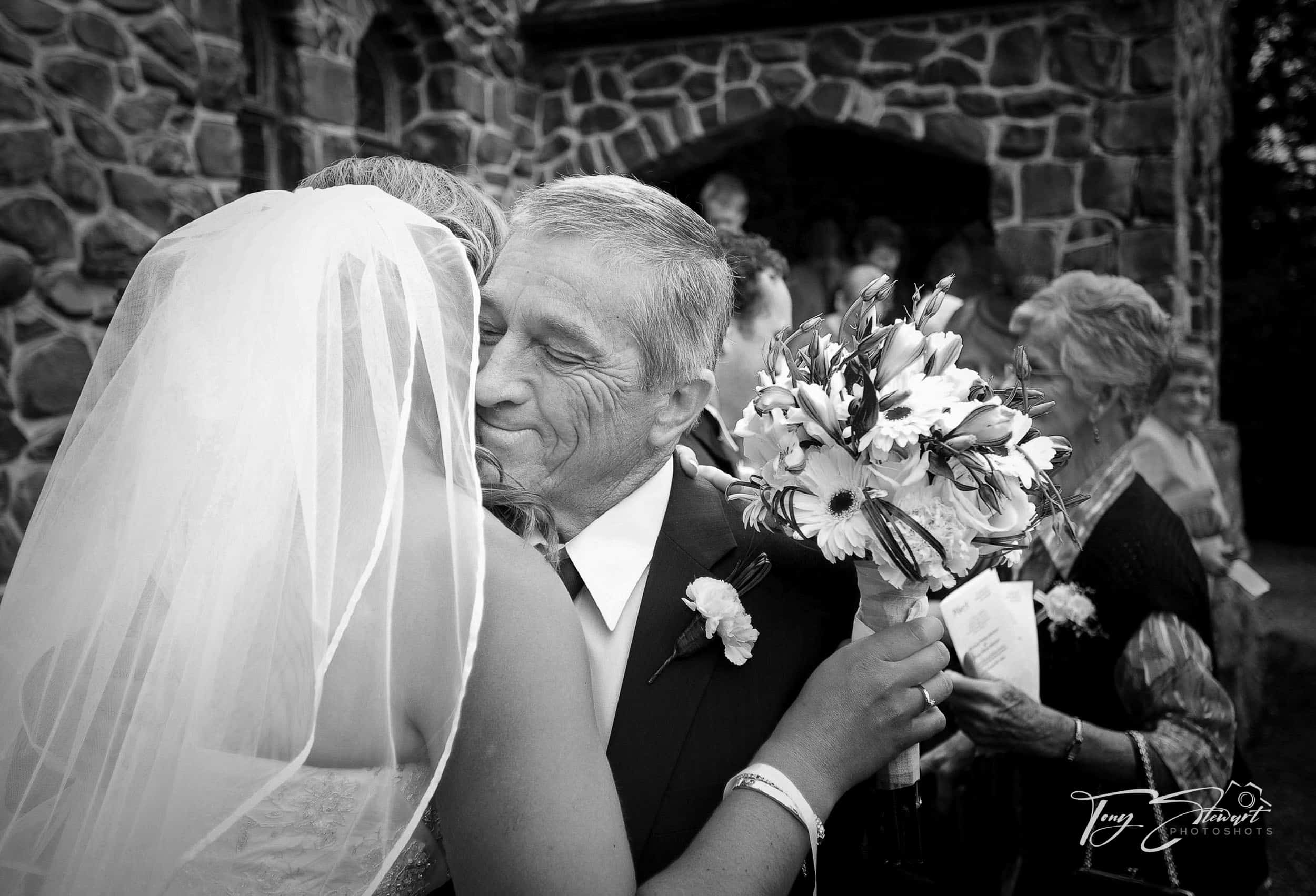 Proud Dad greets bride after ceremony at church in Gerladine.